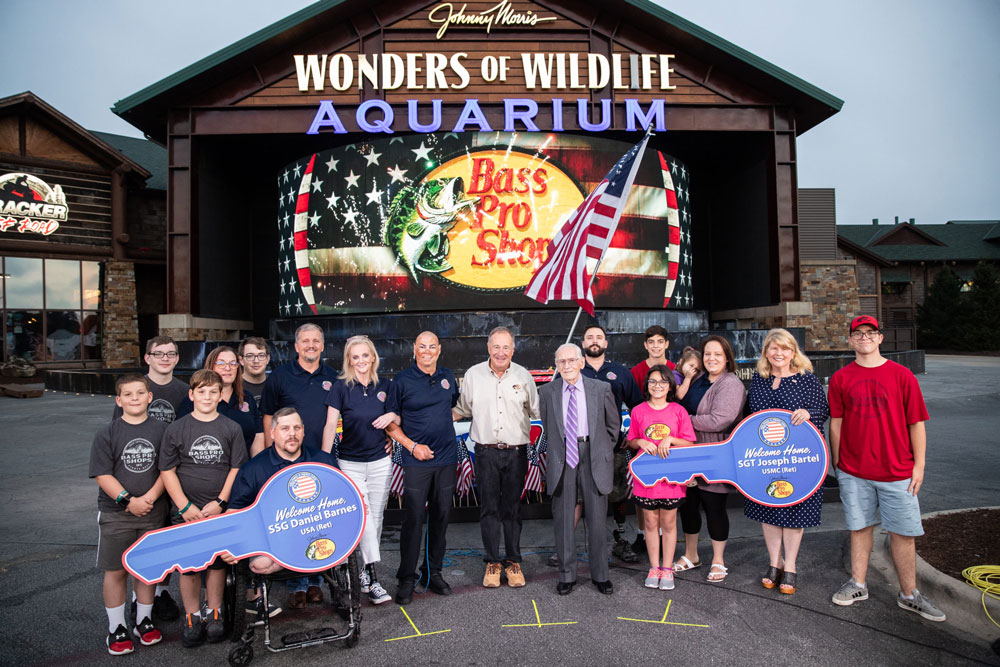 Bass Pro Shops Founder Johnny Morris Surprises Wounded Veterans With 10 Specially Adapted Homes Through Helping a Hero